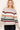 Neutral sweater with multicolored stripes